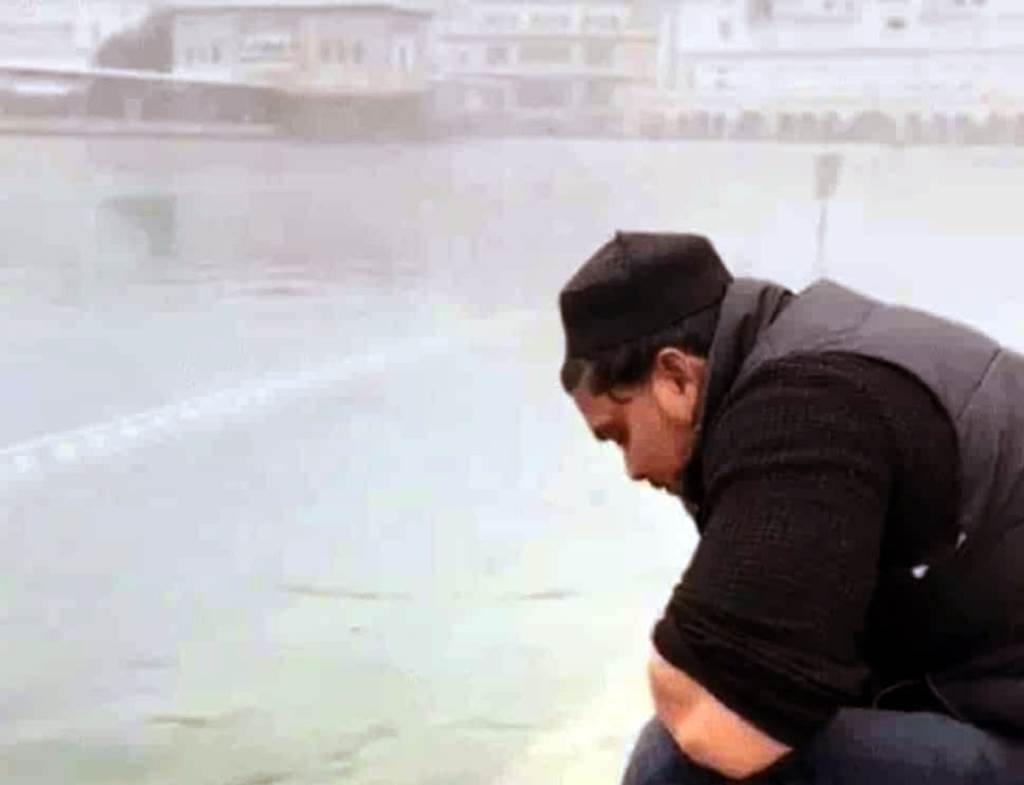 A reel has been made of a young man rinsing his mouth in the Sarovar of Sri Harmandir Sahib in Amritsar